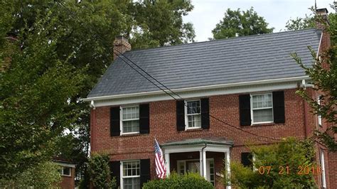 red brick house with black metal roof|roof colors for brick house.